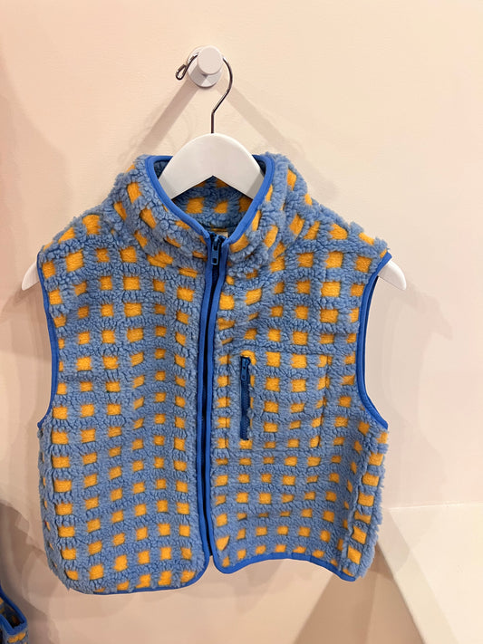 blue sherpa vest on display
