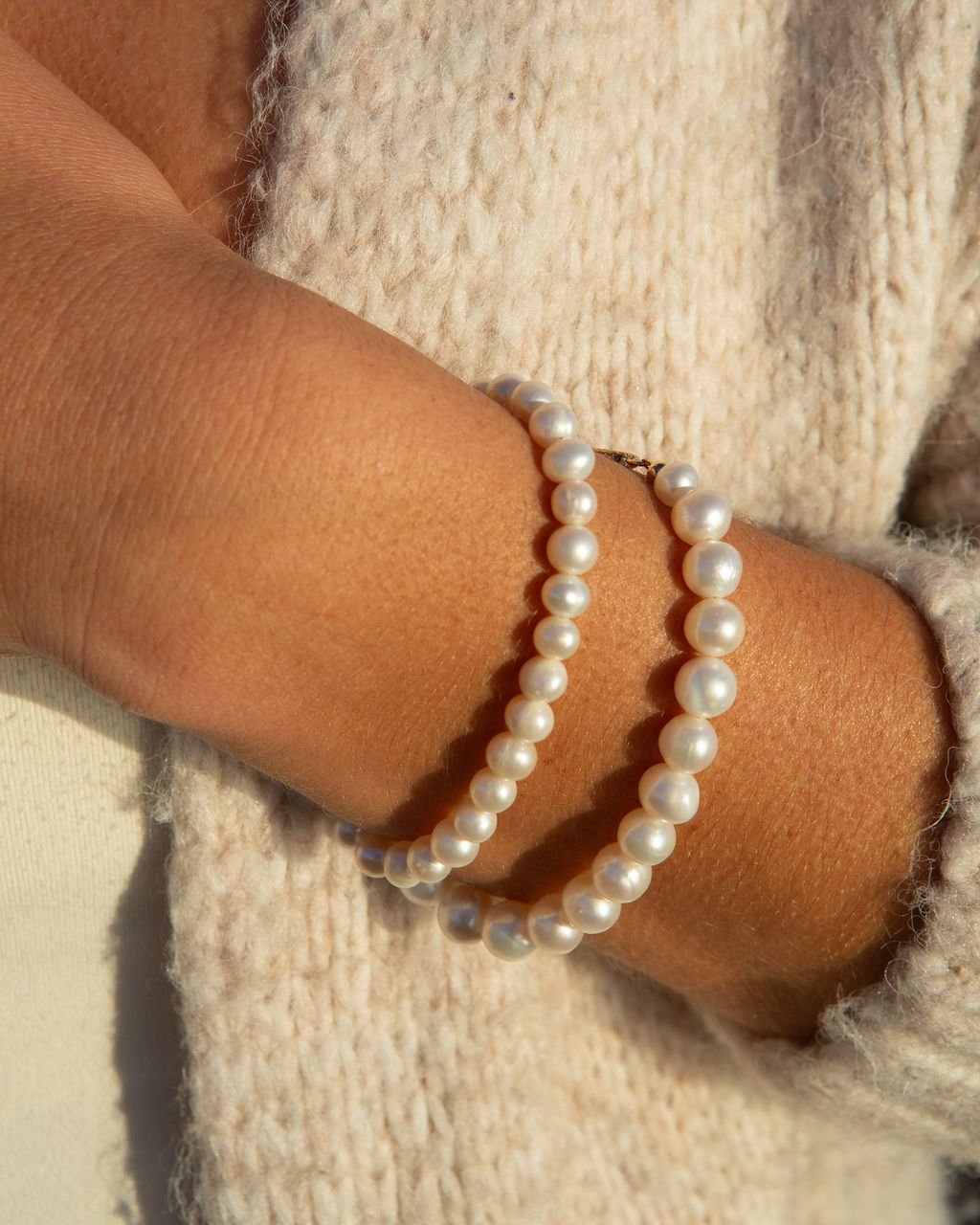 pearl bracelets being worn